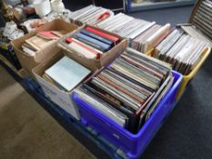 A pallet containing seven boxes of assorted LP's and sheet music