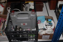 Two boxes containing cased Performance drill, work lights, cabling,