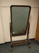 A Victorian mahogany cheval mirror