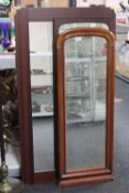 A Victorian mahogany hall mirror together with two other framed mirrors