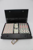 A cased Mah Jong set