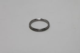 A platinum diamond eternity ring,