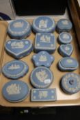 A tray containing fourteen Wedgwood blue and white jasperware lidded trinket boxes