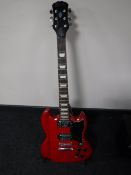 A Lindo electric guitar on stand