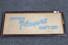 A framed Smoke Player's Navy Cut advertisement