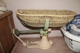 A vintage set of Avery baby weighing scales with basket