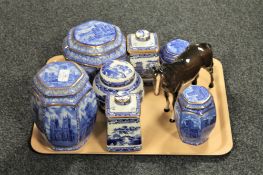 A tray containing seven Ringtons caddies, various,