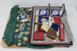 A large collection of enamelled bowling badges and medals
