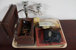 A tray of three piece plated table candelabra, dressing table clock,