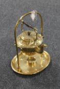 A brass spirit kettle on stand