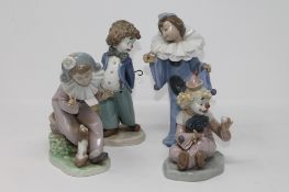 Four Nao figures - Clown with parasol seated, clown holding a ball,