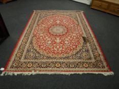 A Keshan carpet on red ground 280 cm x 200 cm
