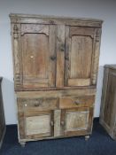 An antique pine kitchen cabinet fitted cupboards and drawers beneath CONDITION REPORT: