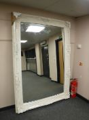 A large white ornate mirror CONDITION REPORT: Frame imperfections