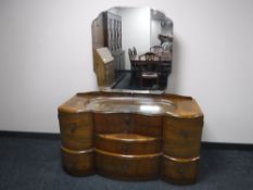 A mid 20th century walnut dressing chest