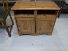 A pair of pine effect bedside cabinets