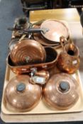 Two trays of antique copper ware, including water bottles, jugs, plant trough,