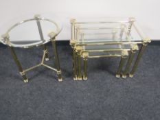 A nest of three brass and glass tables together with a matching brass and glass circular lamp table