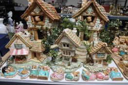 Five Pendelfin houses together with nine Pendelfin figures