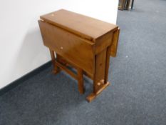 A pine drop leaf kitchen table