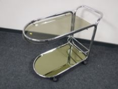 A chrome and glass two-tier drinks trolley