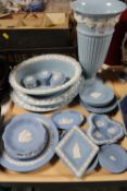 A tray containing sixteen pieces of Wedgwood blue and white jasperware including plated,