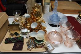 A tray of gilt continental coffee set, Beswick Micawber miniature jug, Festival of Britain coin,