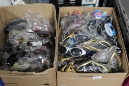 Two boxes containing assorted reading glasses,