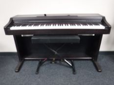A Casio AP1 digital piano on stand with adjustable stool