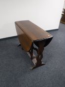 An oak drop leaf table, length opened 136cm.