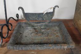 A cast iron boot scraper