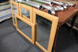 Two early 20th century folding card tables together with four contemporary beech framed mirrors