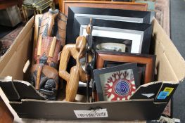 A box of five pieces of tribal art, together with three framed Icelandic fossils,