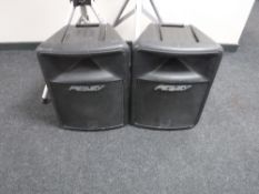 A pair of Peavey Impulse 200 PA speakers with tripod stands