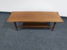 A 20th century teak low coffee table with undershelf