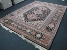 A fringed woollen Keshan machine made carpet on black ground