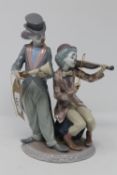 A Lladro figure group - clown playing violin and clown with horn CONDITION REPORT:
