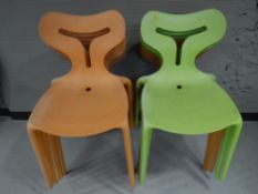 A set of twelve plastic stacking chairs