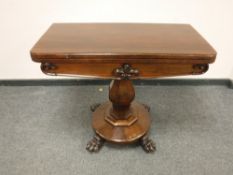 A Victorian mahogany pedestal turn over top card table