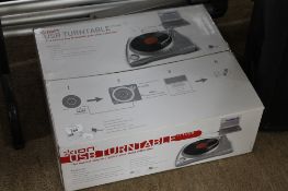 A boxed Ion USB turntable