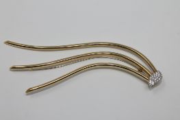 An 18ct gold diamond set hair ornament,