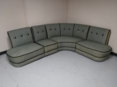 A mid 20th century four section corner settee