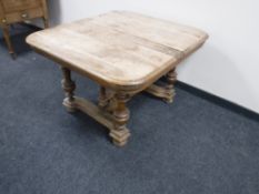 A French walnut dining table with under stretcher CONDITION REPORT: Poor condition.