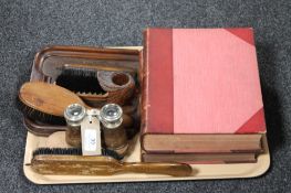 A tray containing pair of opera glasses, clothes brushes, crumb scoop,