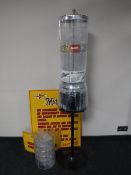 A sweet dispenser on stand with keys together with extra carousel and three Metro Land safety