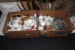 Two boxes of assorted commemorative mugs, glass ware,