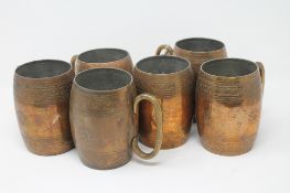 A set of six antique copper plated beer tankards (6)