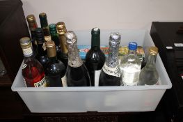 A box containing fourteen assorted bottles of wine and alcohol including sherry, Russian vodka,