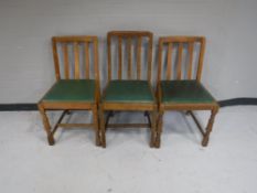 Three 20th century oak dining chairs