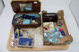 A tray of silver bracelet, Chinese figure, trinket box and costume jewellery,